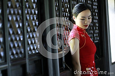 Chinese cheongsam model in Chinese classical garden Stock Photo